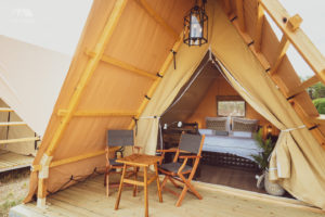 Queen bed in A-Frame Safari Tent